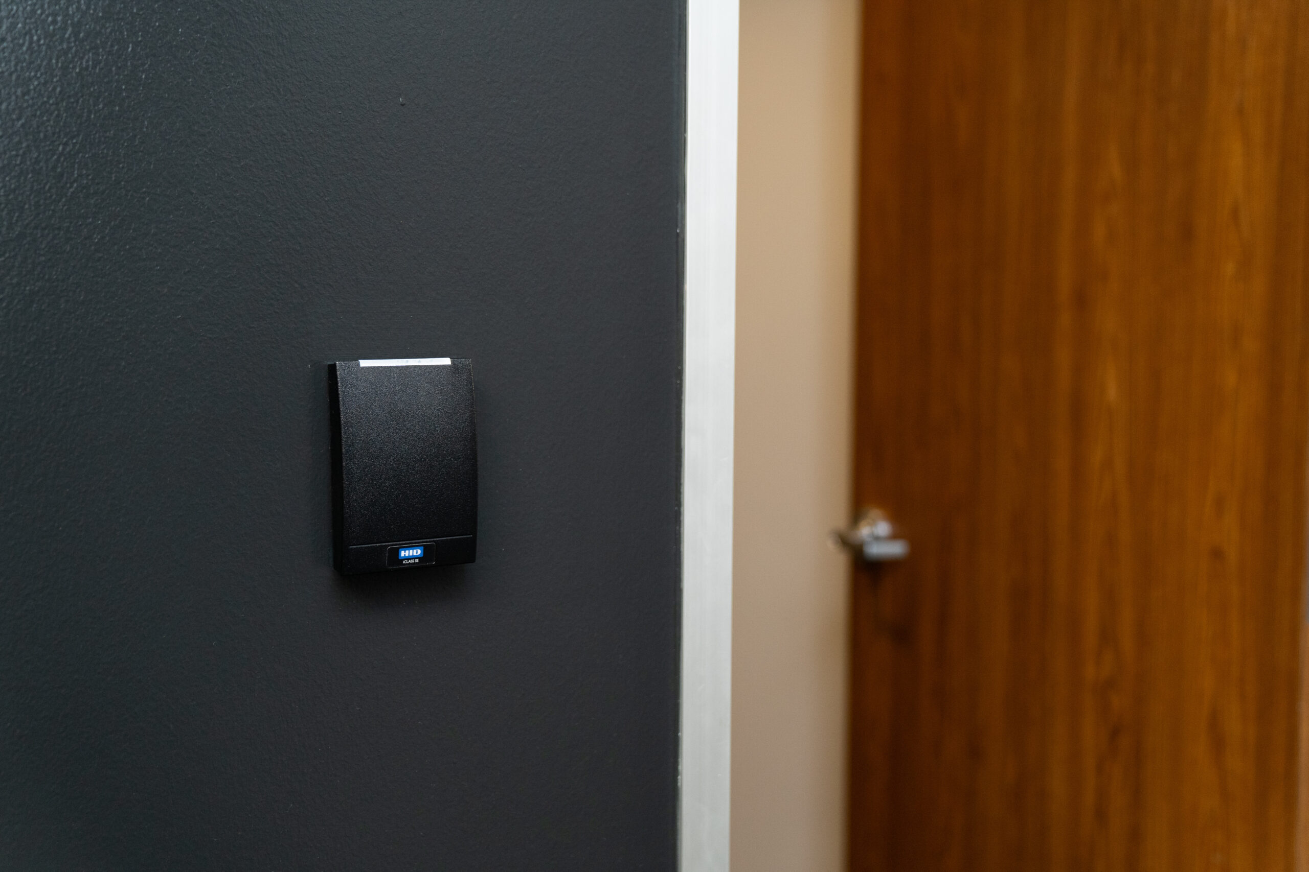 Access Control Systems - a card reader by a door that is controlled by an ACS
